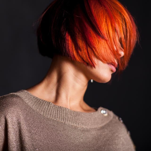 A red-haired woman with stylish haircut